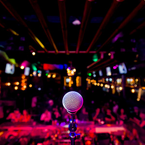 Comedy Microphone on Stage of Comedy Music Show in Club with Lights